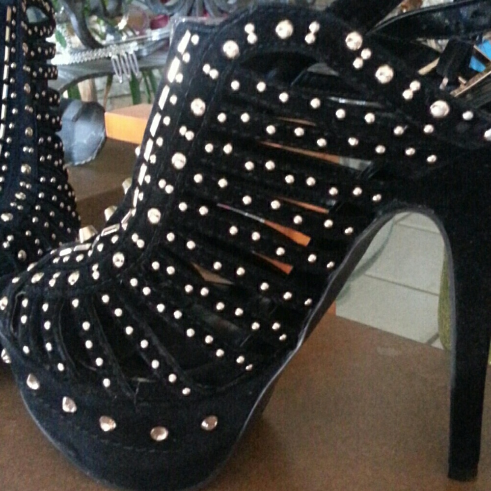 Black suede platform heels.